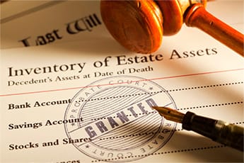 Inventory of Estate Assets sheet with gavel and pen